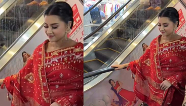 লাল শাড়িতে শপিংমলে হাজির বুবলী