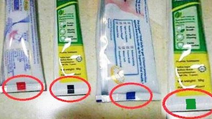 টুথপেস্টের টিউবের নিচে রঙিন দাগ থাকে কেন