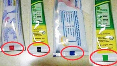 টুথপেস্টের টিউবের নিচে রঙিন দাগ থাকে কেন